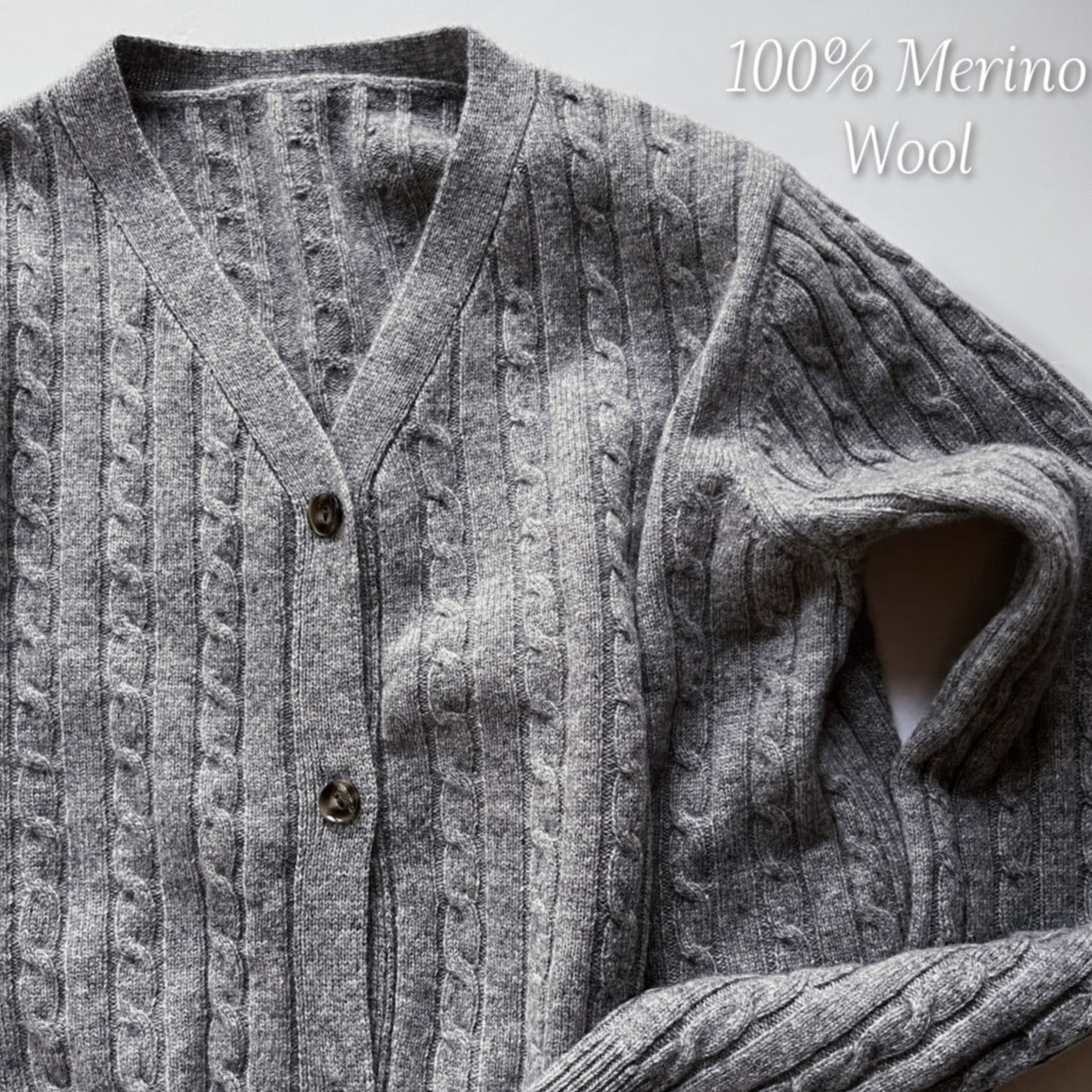 The cardigan's grey hue is versatile, easily paired with a variety of outfits, and the additional swatches indicate it may be available in other rich colors such as blue, white, and darker shades, providing options to suit every wardrobe.