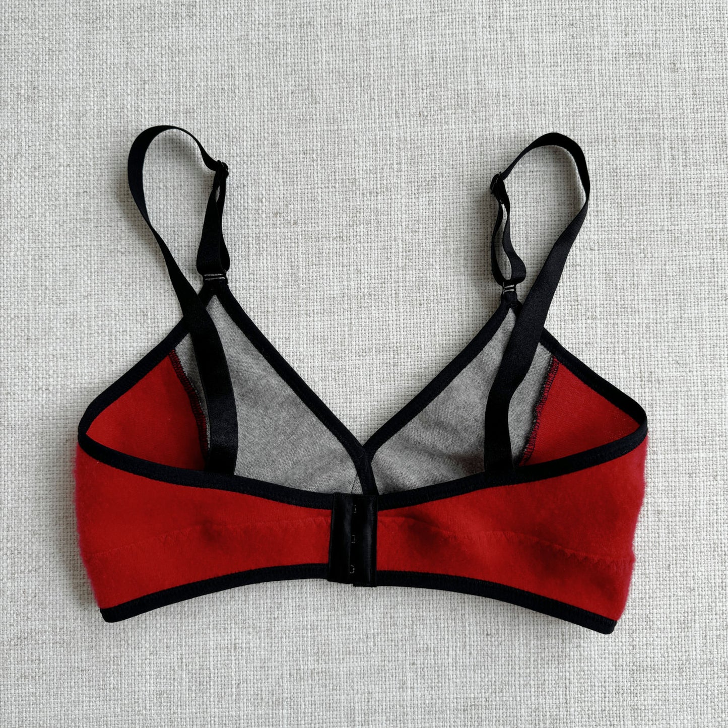 The unique long design of this cashmere bra top sets it apart from traditional bras, offering a touch of elegance and extended coverage. The harmonious blend of Grey and Red hues creates a visually striking contrast, perfect for those looking to add a pop of color to their wardrobe. Each piece is expertly handcrafted by Canadian artisans, ensuring a high level of attention to detail and quality
