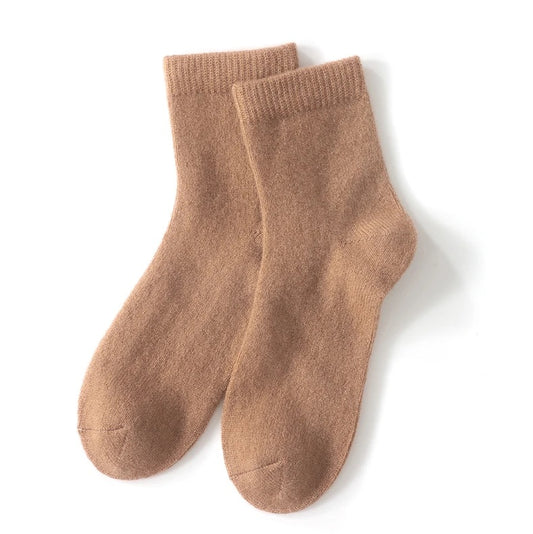 Pair of brown socks on a white background