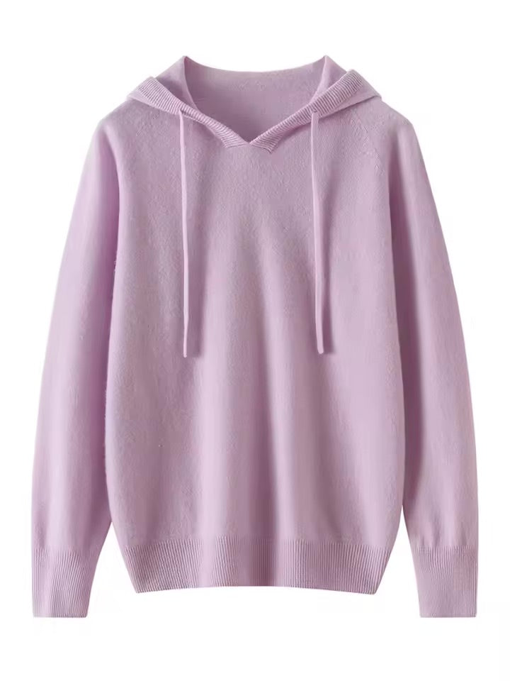 A green cashmere knit hoodie with long sleeves and drawstrings.