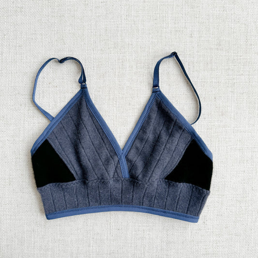 Dusty Blue and Black long cashmere bra top, handmade in Canada by Econica, sumptuous cashmere fabric, elegant and timeless colors, soft and plush comfort, sustainable and ethical production, contemporary style, artisanal touch, luxurious loungewear, refined simplicity