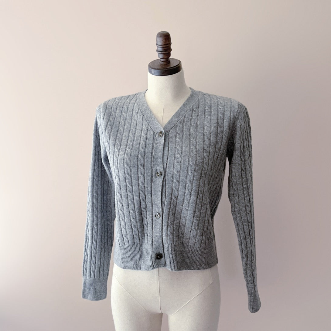 The Merino Wool Cardigan featured in the attached image is a testament to skilled craftsmanship, perfect for women who appreciate the blend of classic style and cozy warmth.