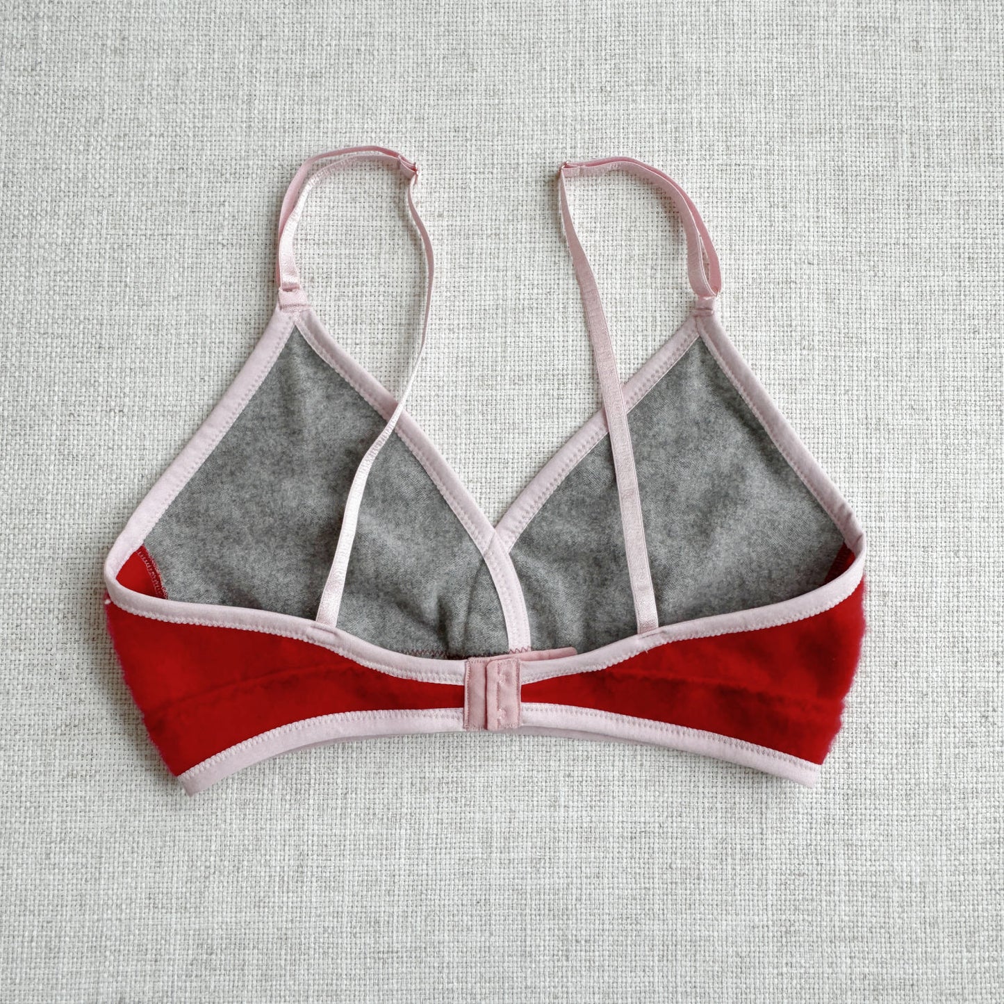 Add a touch of luxury to your everyday with Econica's Grey, Red, and Pink long cashmere bra top. Handcrafted in Canada with the softest cashmere, this bra top combines style, comfort, and sustainability. Whether you're lounging at home or looking for a chic layering piece, this cashmere bra top is sure to become a cherished addition to your wardrobe, offering a perfect blend of warmth, elegance, and ethical fashion.
