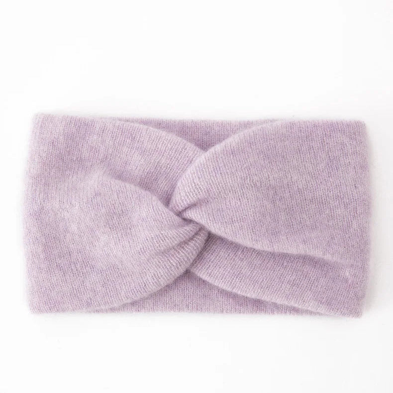 Lavender cashmere headband with a twisted design on a white background