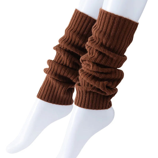 Brown knitted leg warmers on a white background