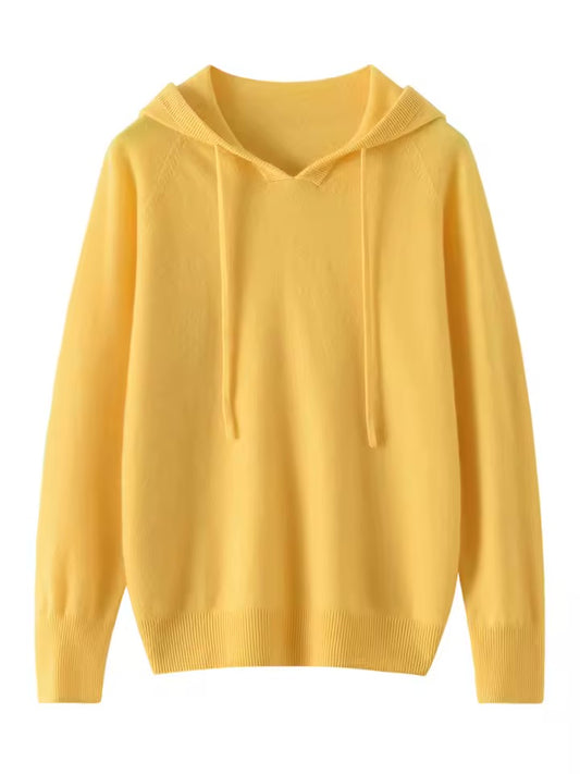 A green cashmere knit hoodie with long sleeves and drawstrings.