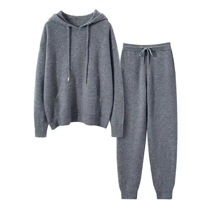 Gray cashmere hoodie and pants set on a white background with 'A Cashmere Studio' branding.