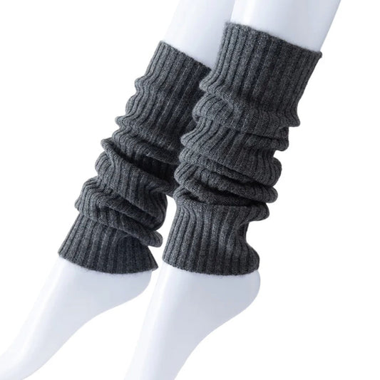 Gray ribbed leg warmers on a white mannequin.