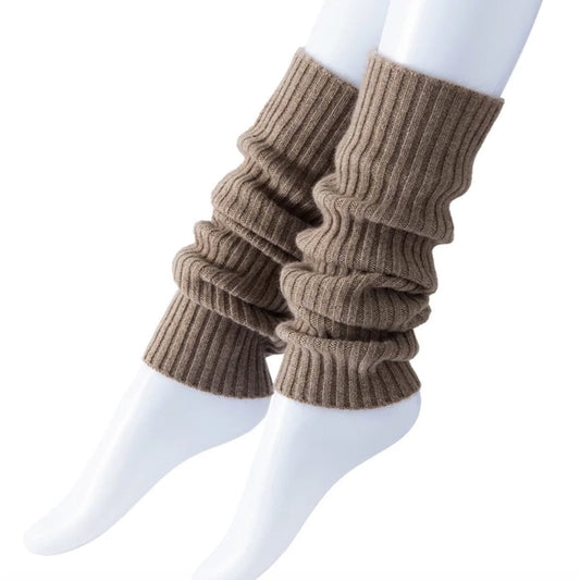 Brown ribbed leg warmers worn over white socks on a white background